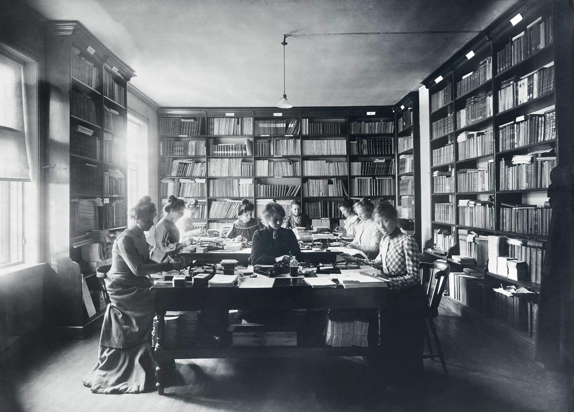 female workers doing manual summarization in office