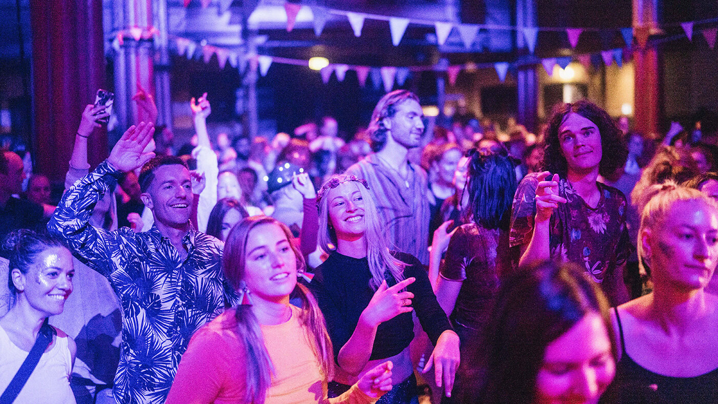 Happy women and men dancing during the morning beat