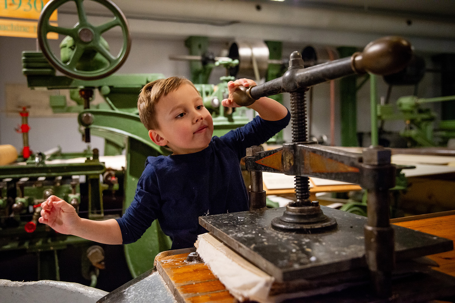 Boy with paper press