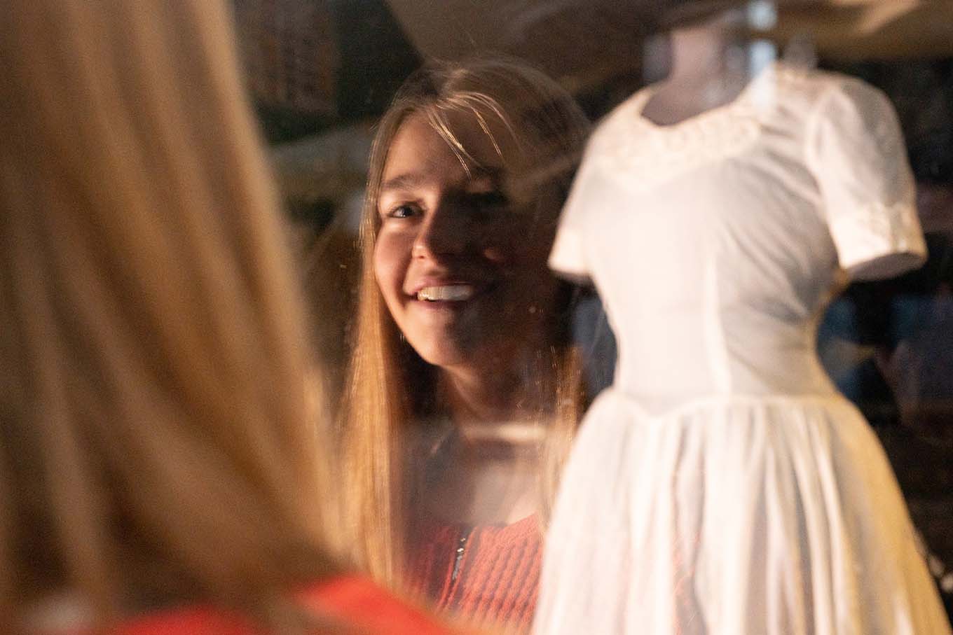 Image of girl looking at the artwork bridal outfit