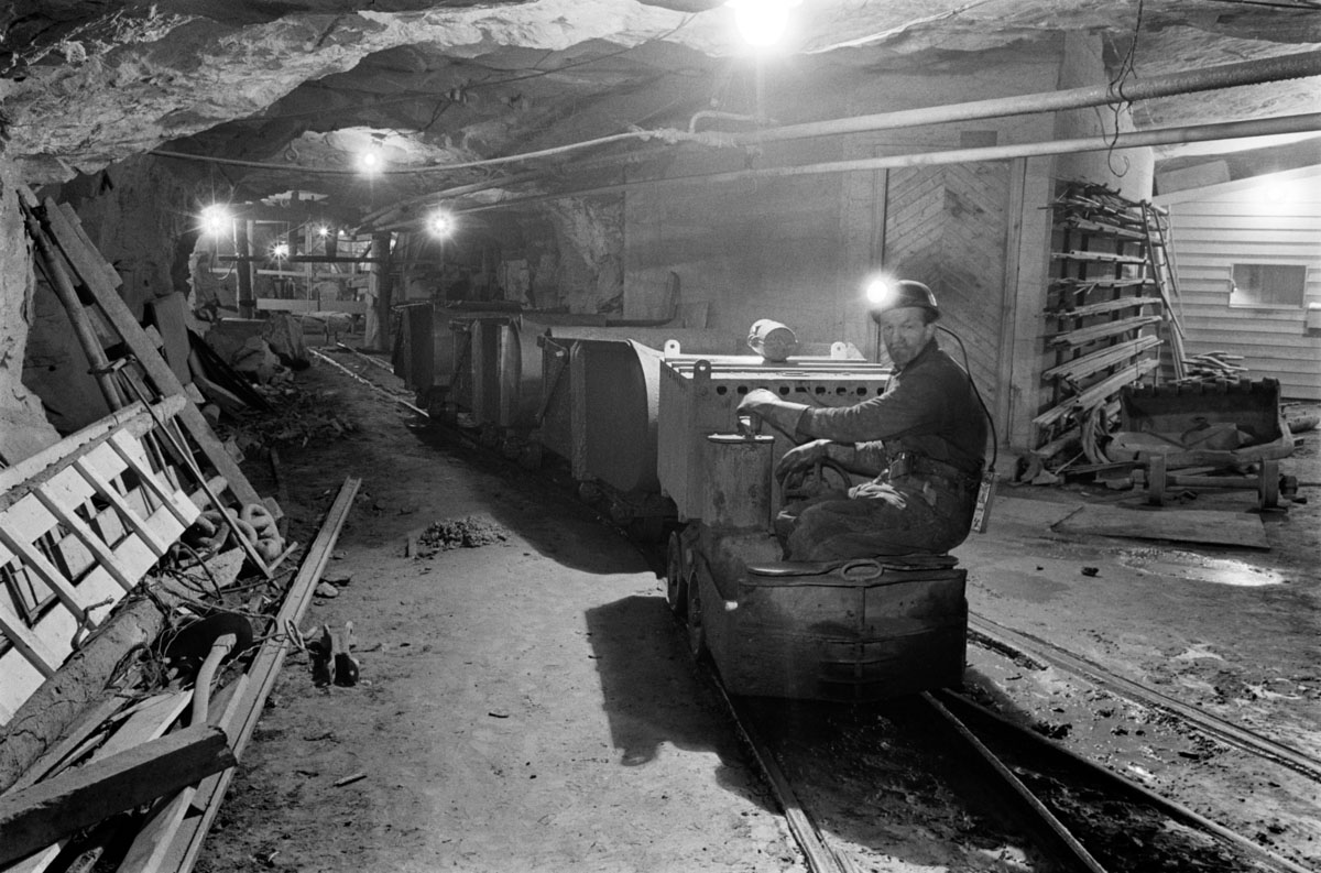 working in a mine with machines