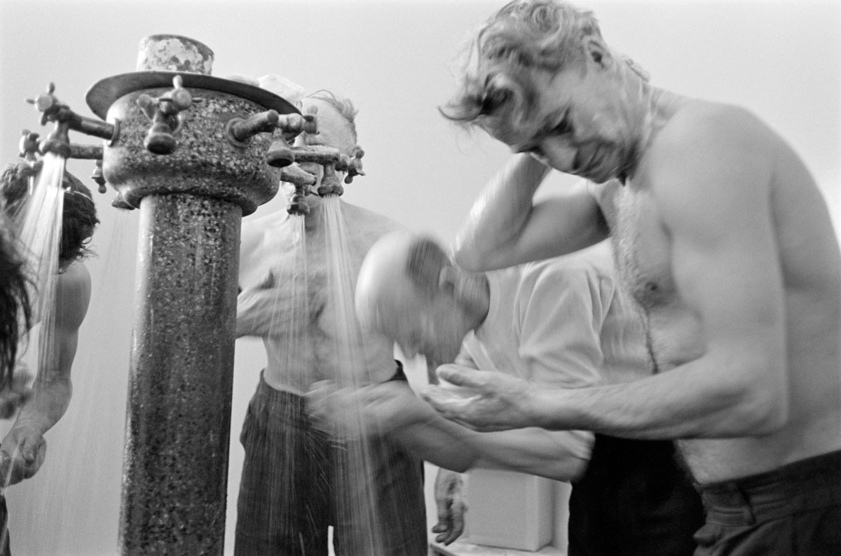 a group of miners washing themselves