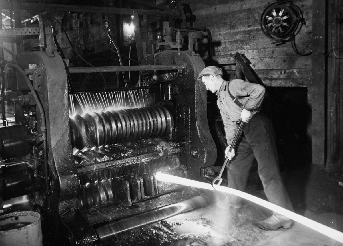 worker cooling steel in water
