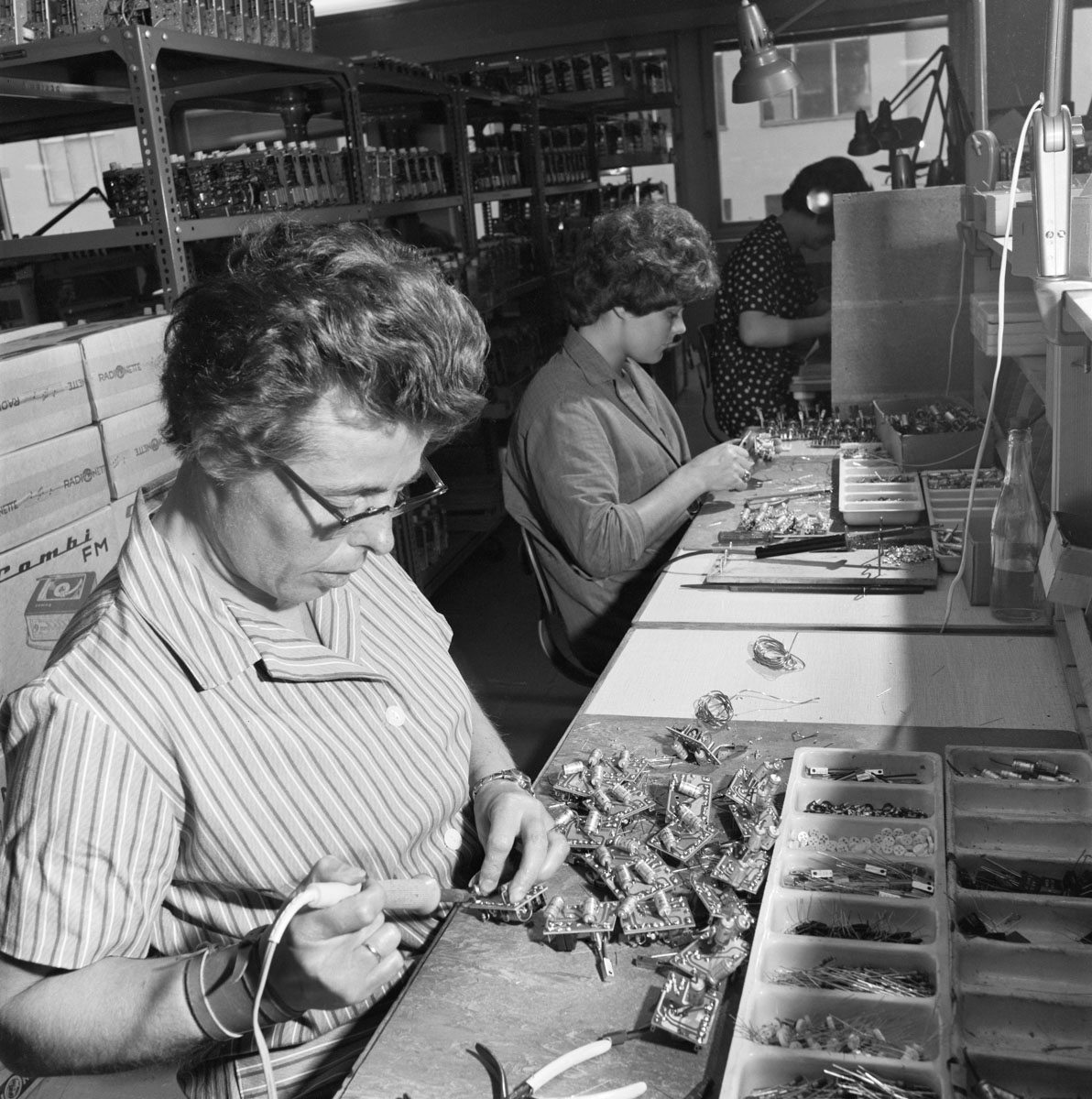 workers assemble old radios