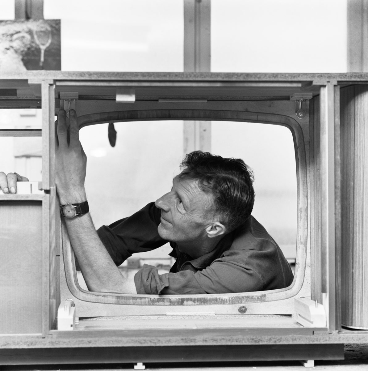 worker installing a television