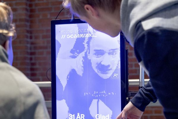two people looking at a screen