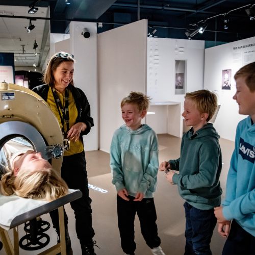 3 children and an adult in a medical exhibit