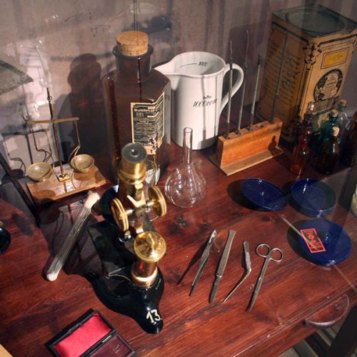 An old table filled with medical items. Photo.