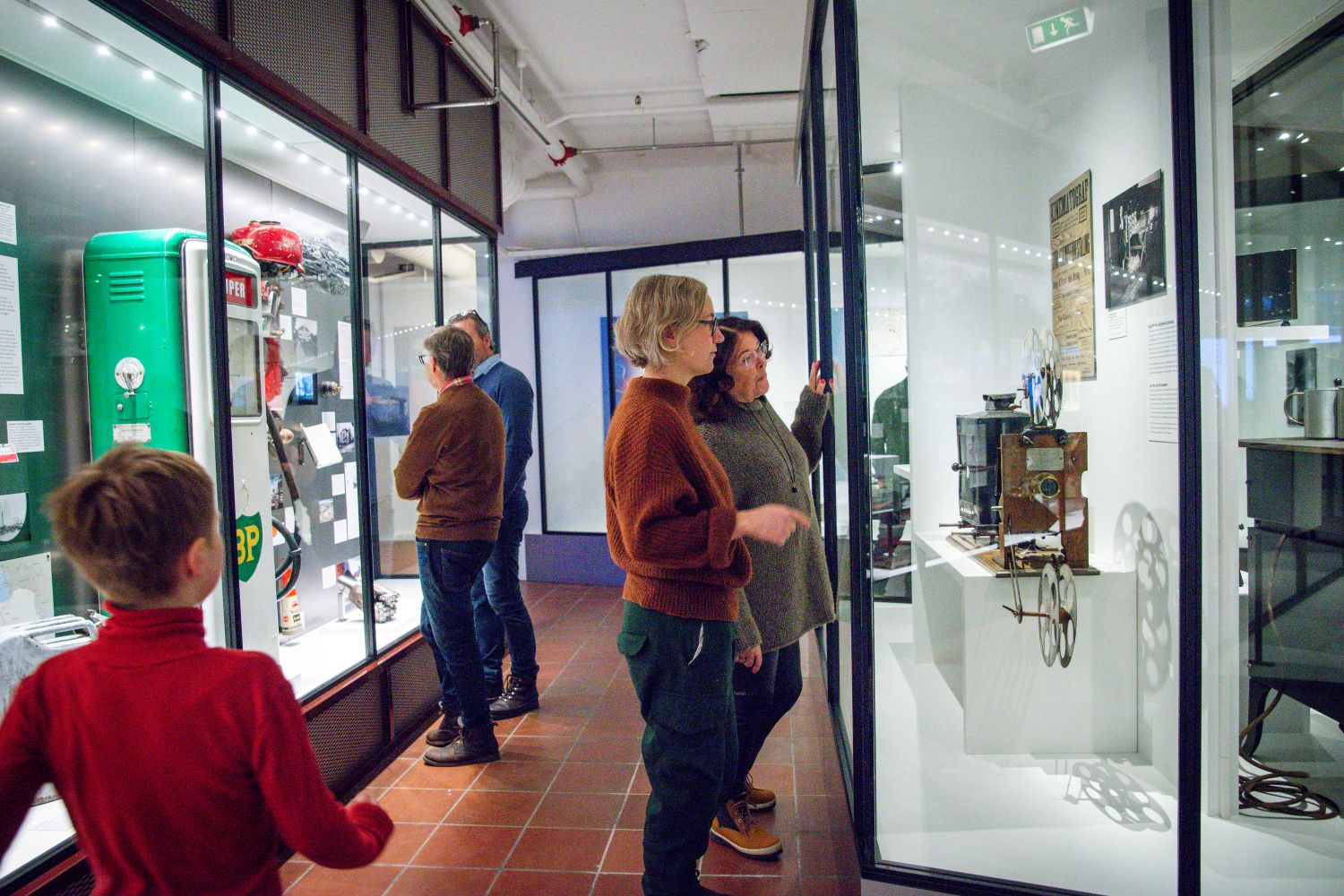 A child and adult look at objects in mounting