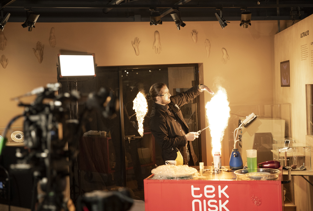 Long-haired man holds science show and plays with flames