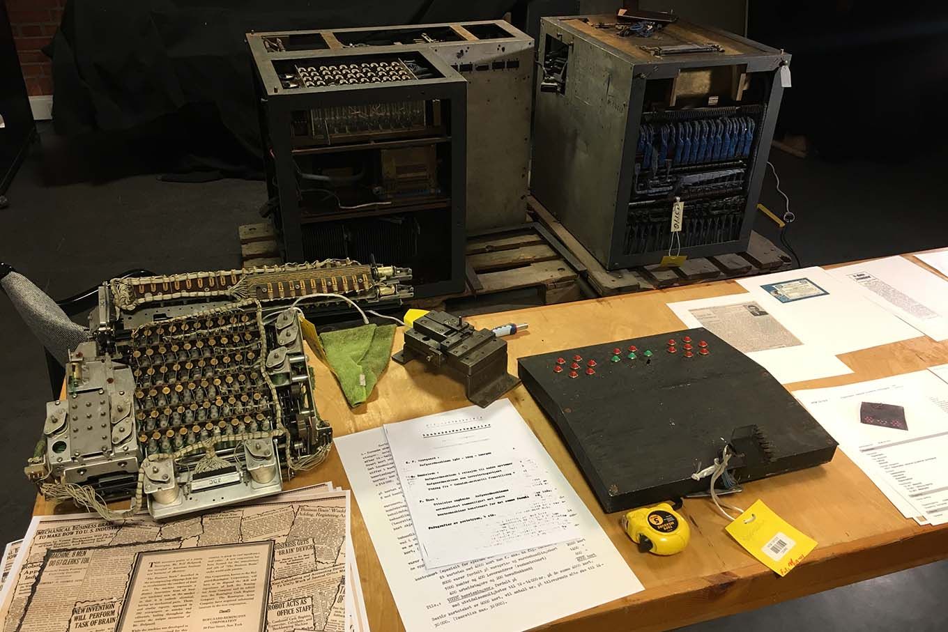 Machine parts and papers on a table