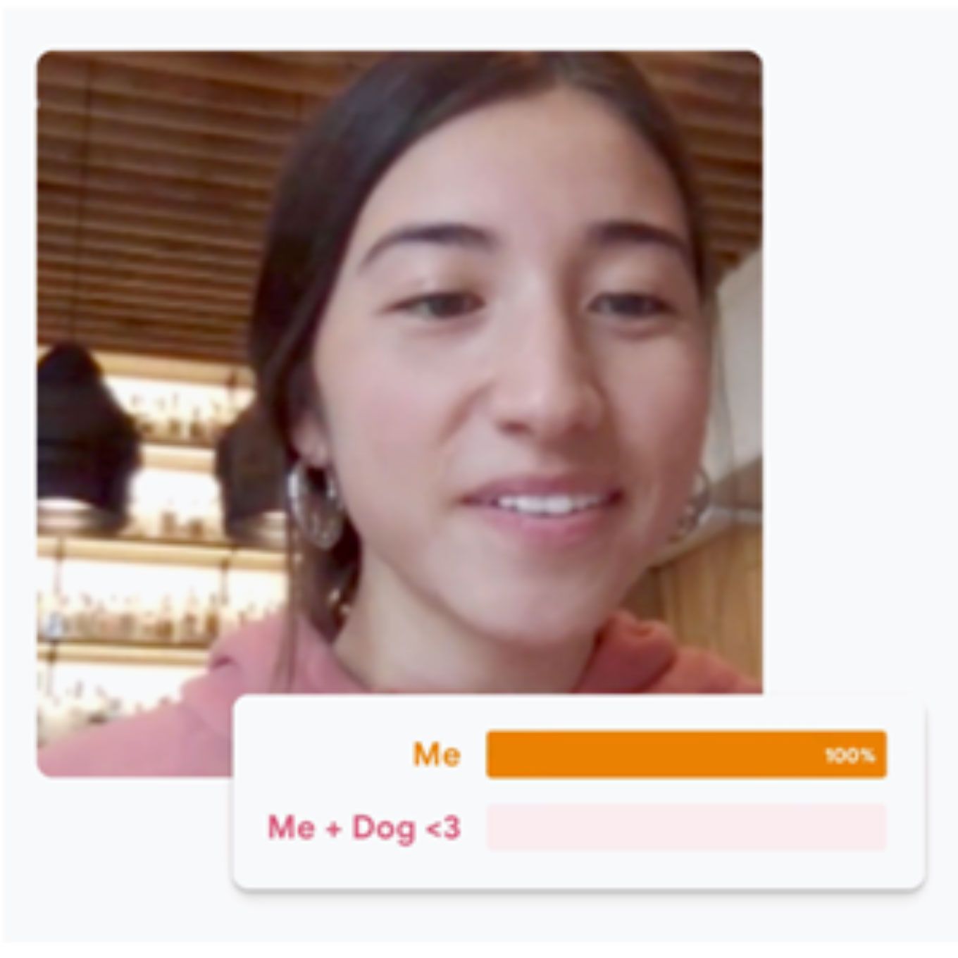 A girl in a lab coat raises her hand. Photo.  