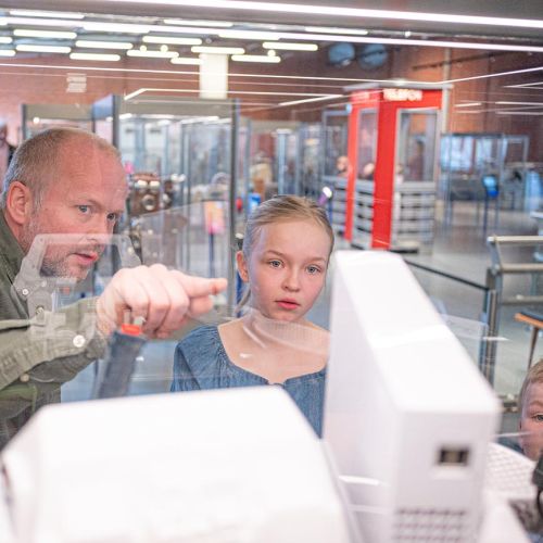 Mother and daughter sitting on a motorcycle. Photo.