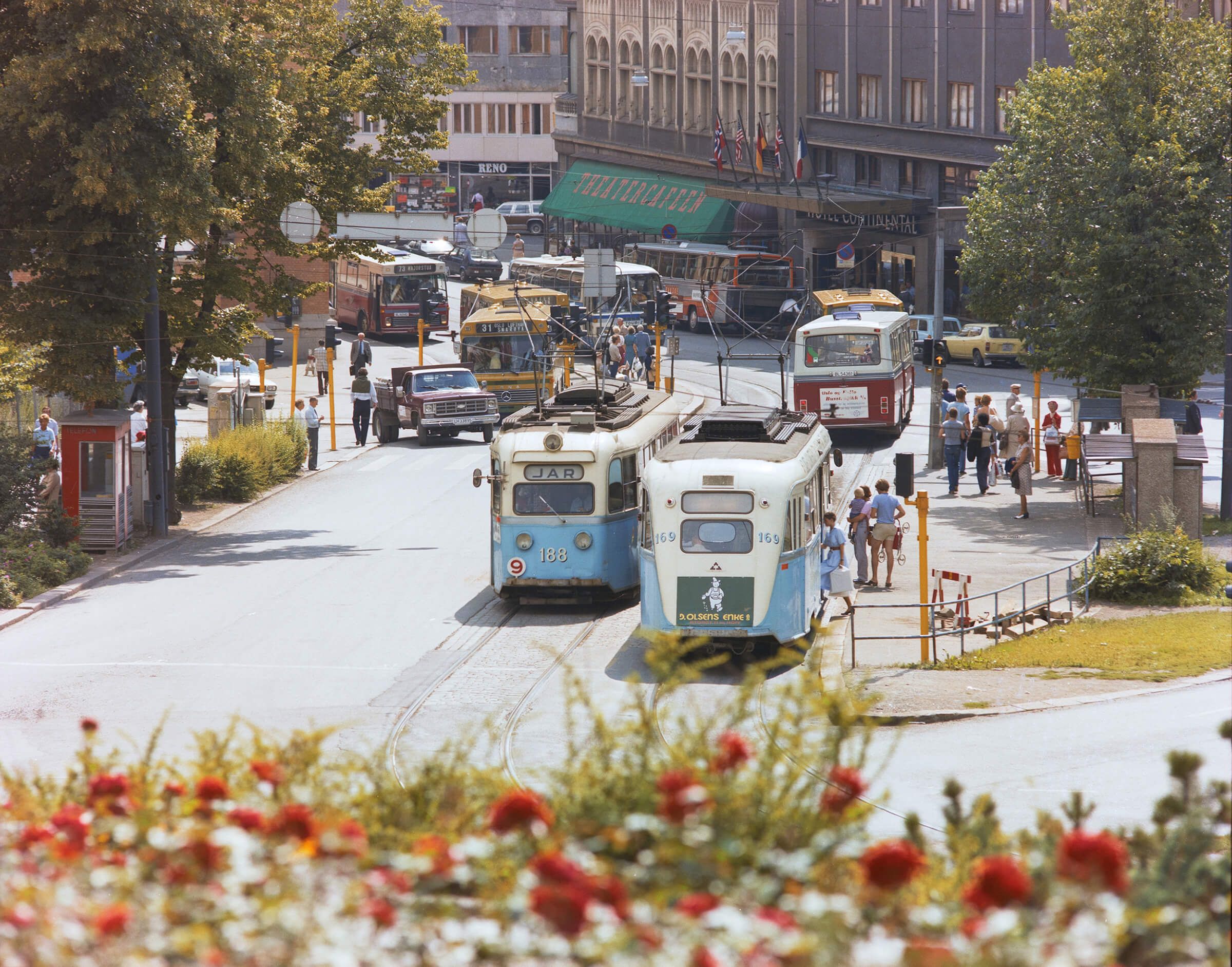 two classic goldfish trams at the theater cafe in oslo on a summer day
