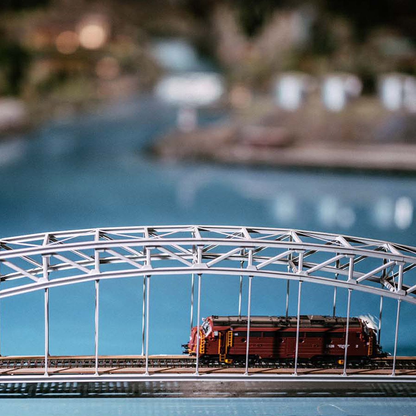 Model train running over a bridge