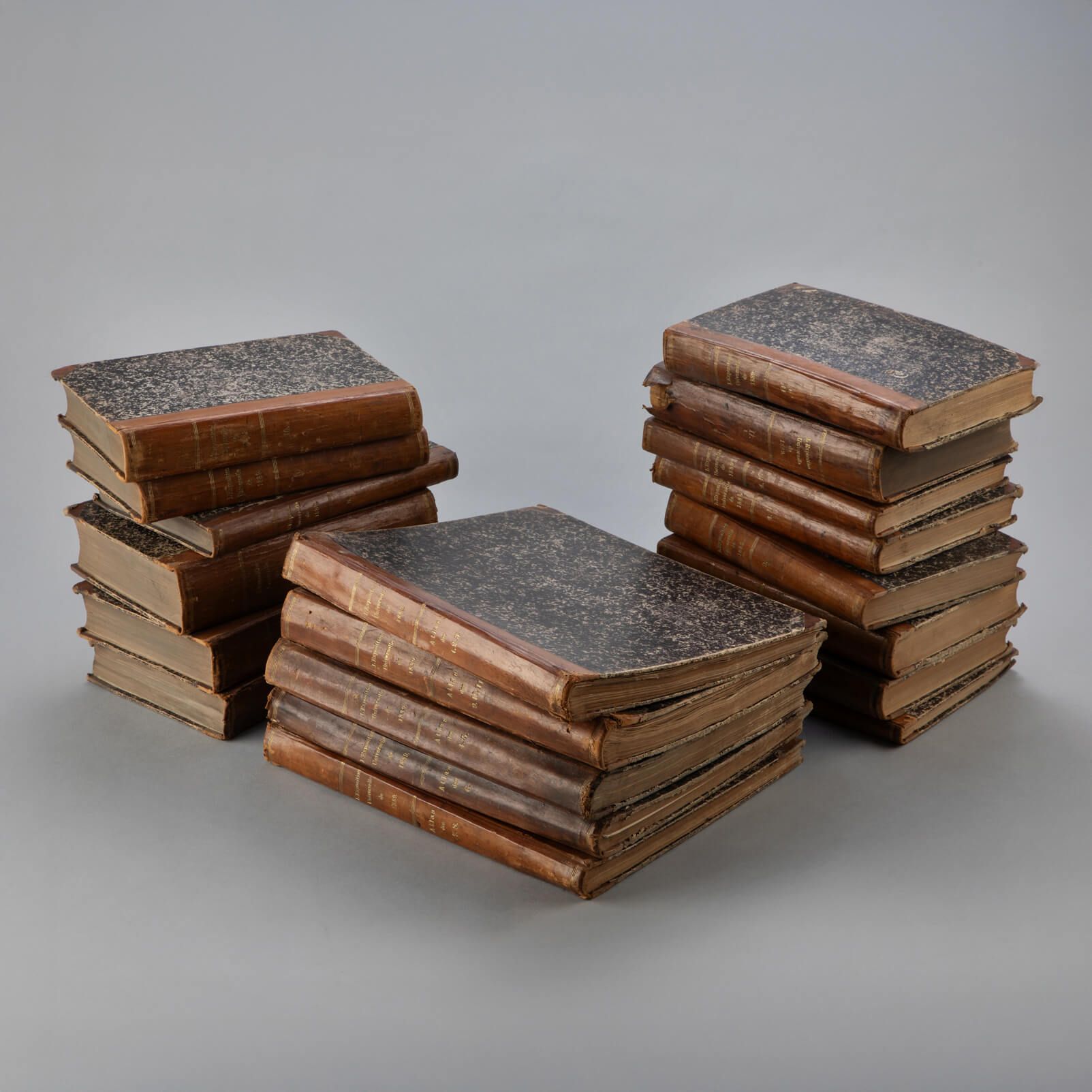 A stack of historical books from the 19th century taken from The Norwegian Museum of Science and Technology &#39;s collection at Kjelsås in Oslo